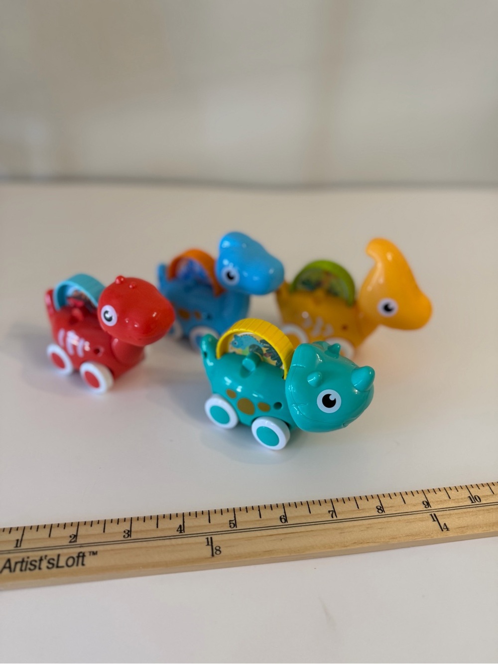 4 rolling dinosaur toy cars. Motor skills. Eye hand coordination. 1 year olds.
